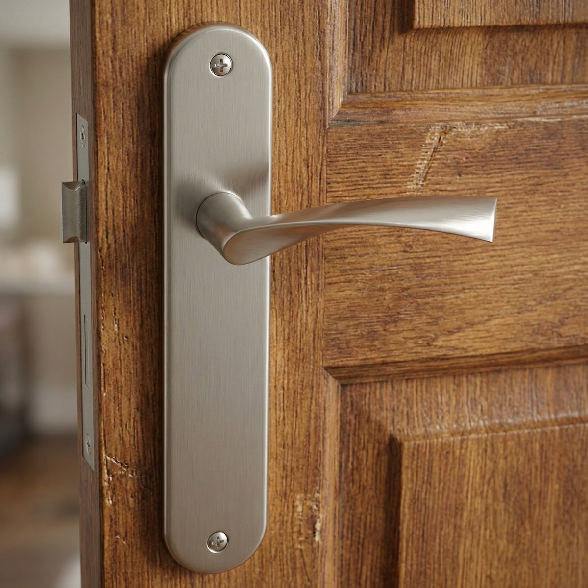 Maniglia modello '130A' onda con placca ovale in alluminio per porte in finitura nichel satinato