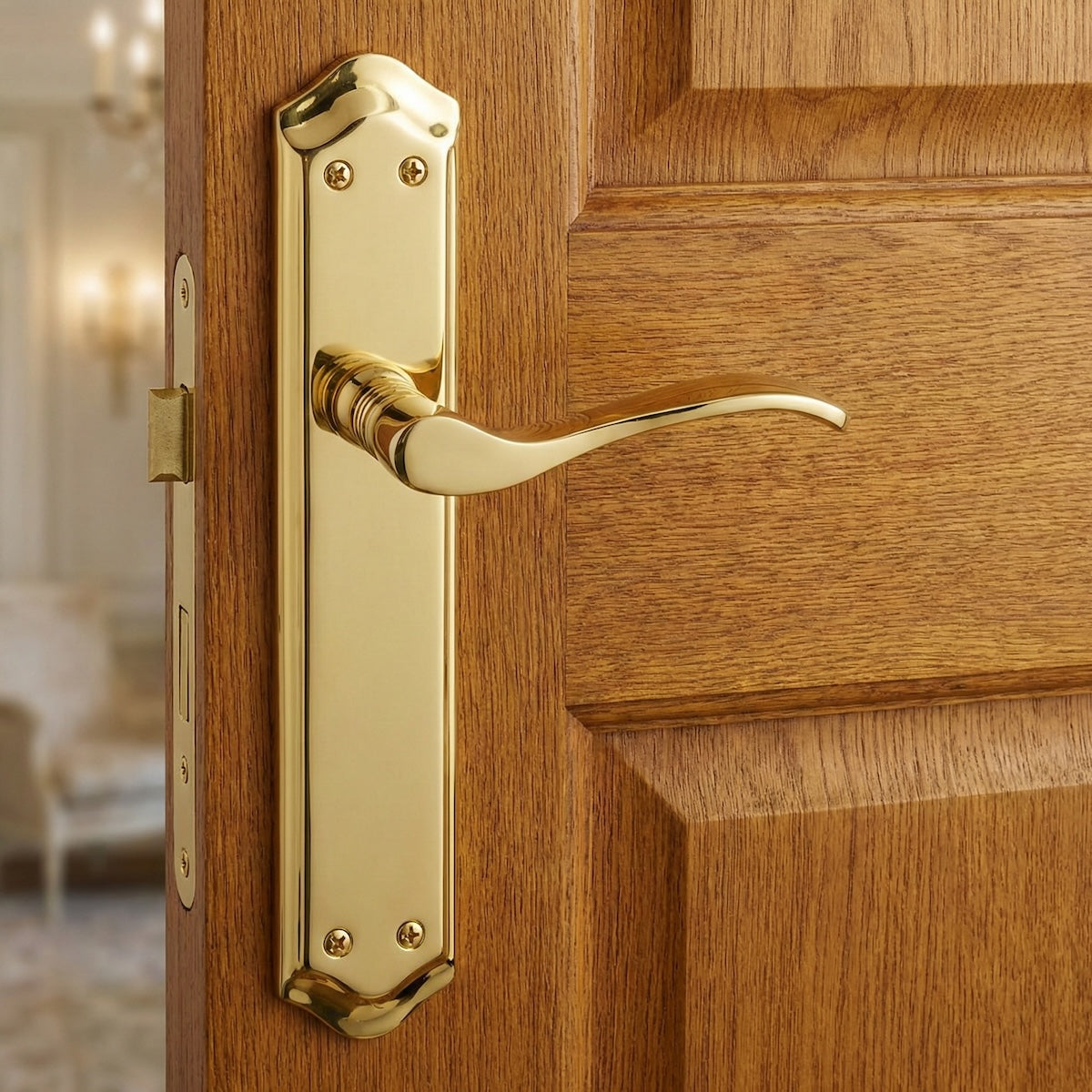 Maniglia modello '881' con placca ovale in alluminio in finitura oro satinato per porte